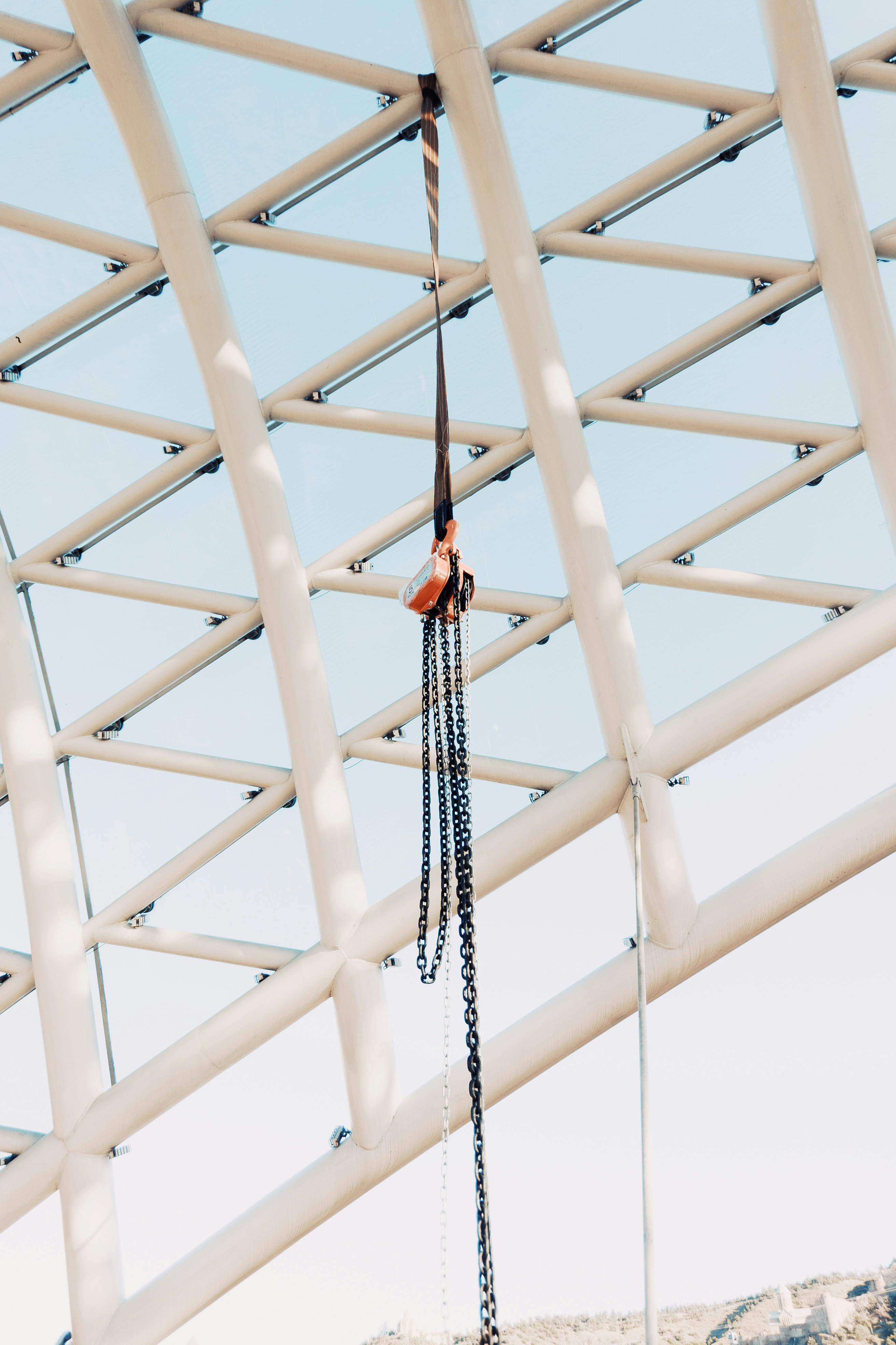 Lift Chain Hanging on Openwork Ceiling · Free Stock Photo