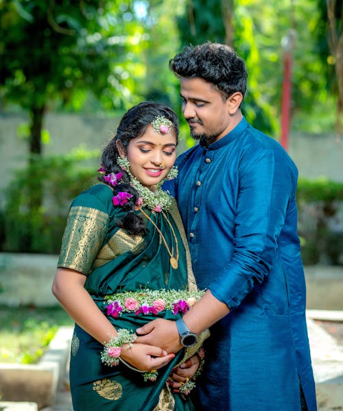 Portrait of a Husband and a Pregnant Wife in Traditional Clothing 