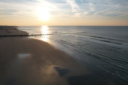 Sun Setting over a Sandy Beach