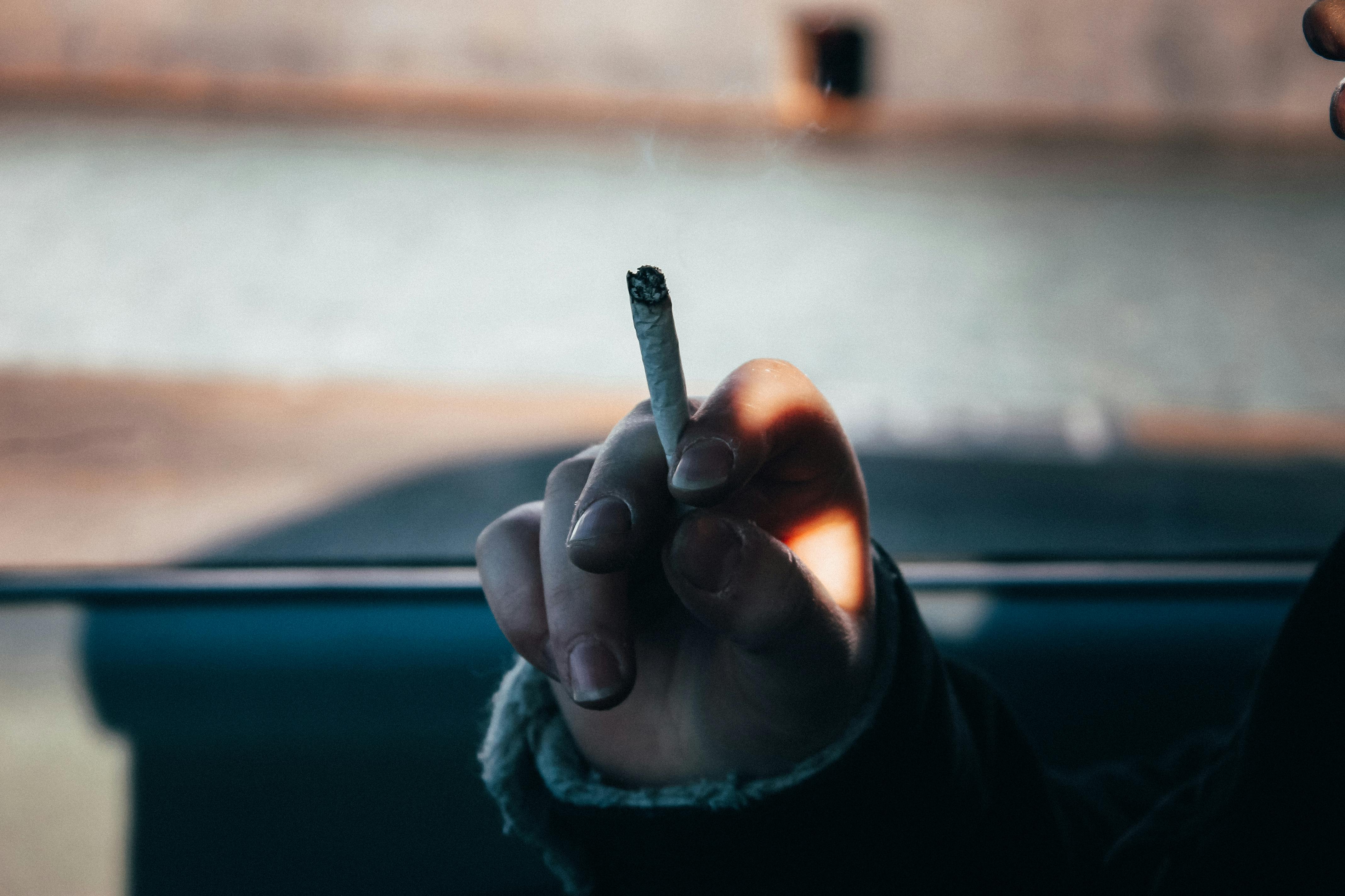 Man Smoking a Cigarette at Night · Free Stock Photo