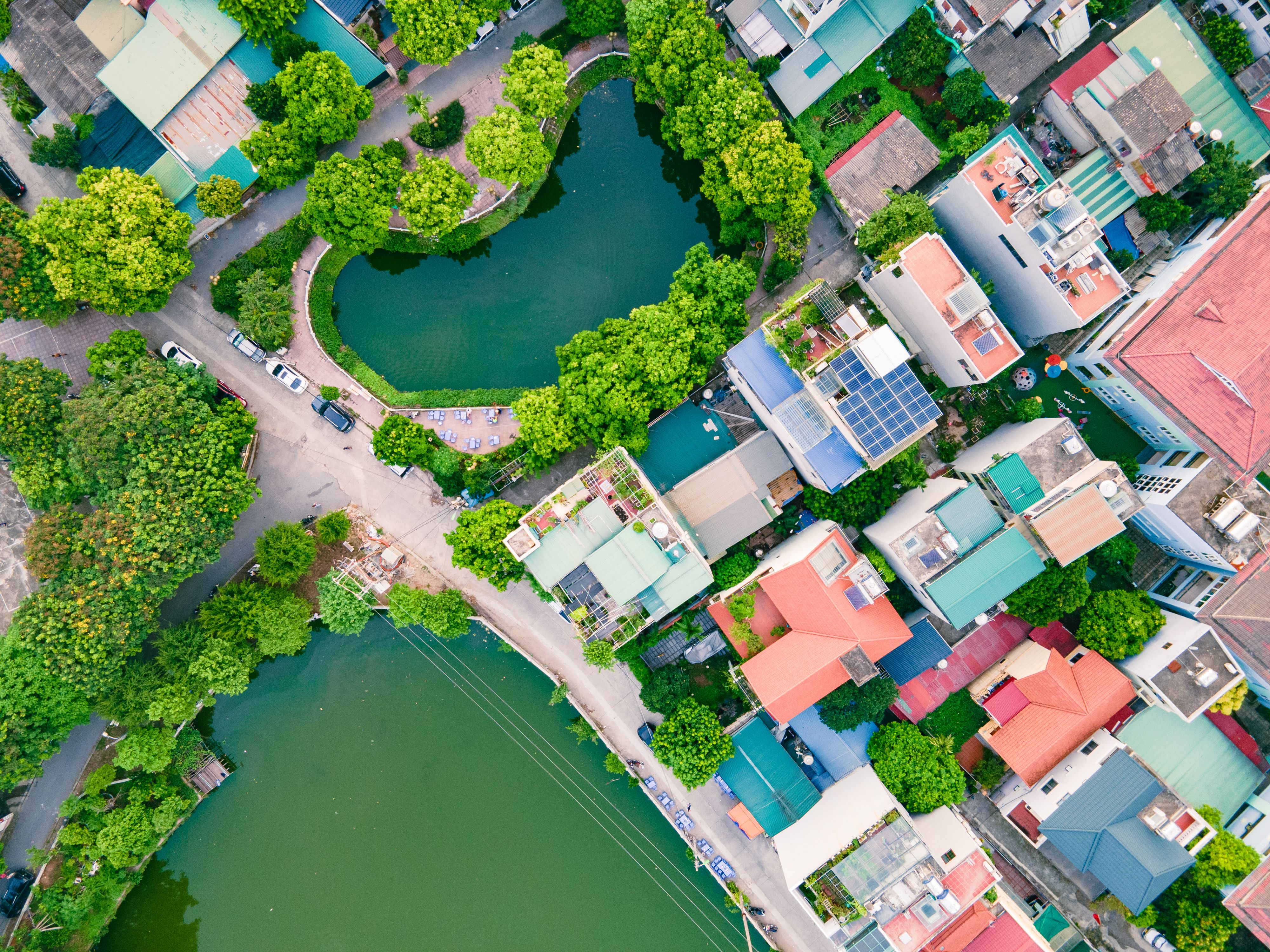 Discover Hanoi's vibrant architecture and serene ponds from an aerial perspective. A mix of tradition and modernity.