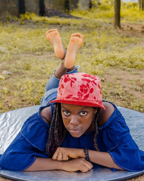 Young Woman Posing in Red Hat