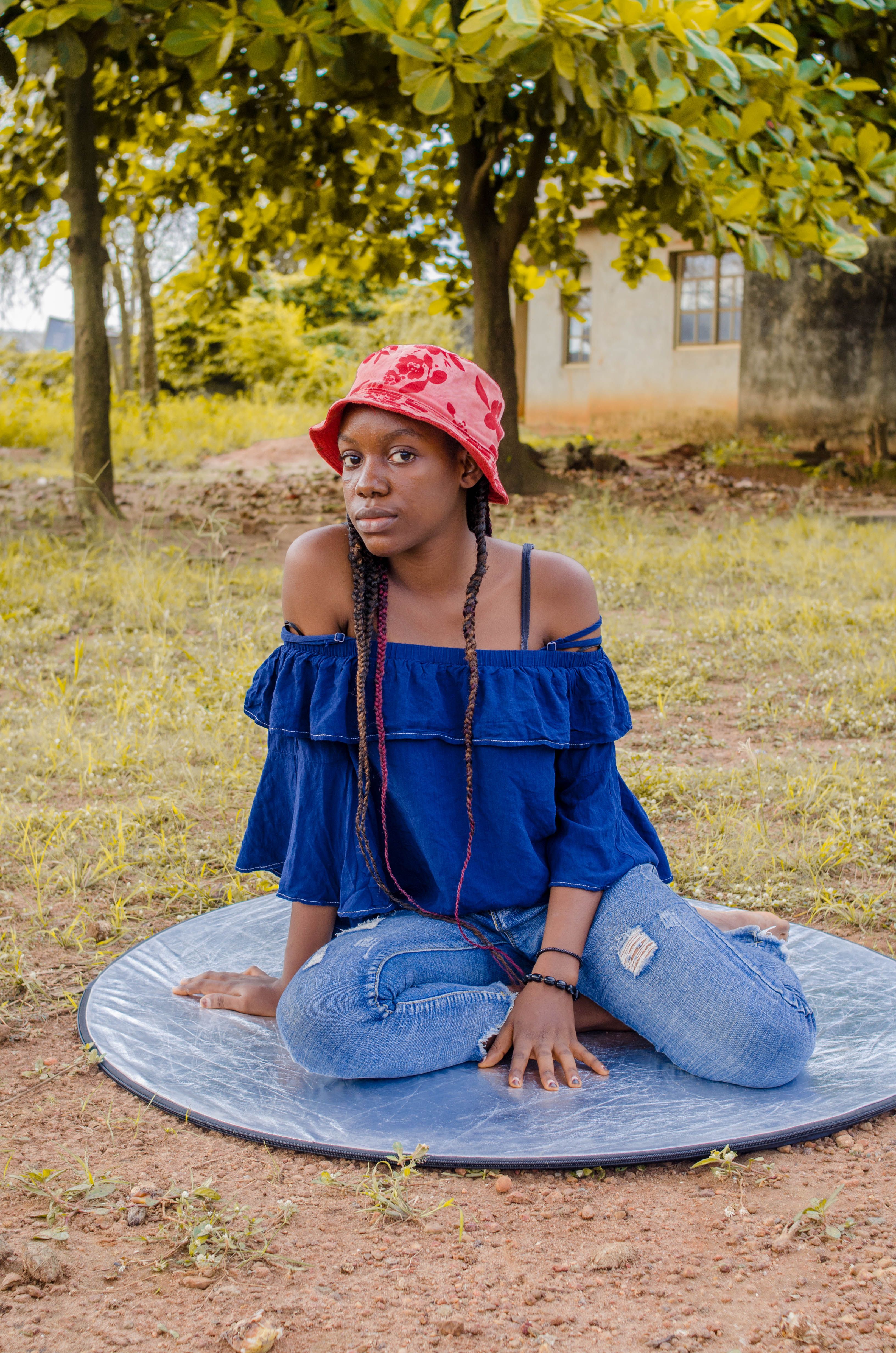 A Woman Sitting on the Ground · Free Stock Photo