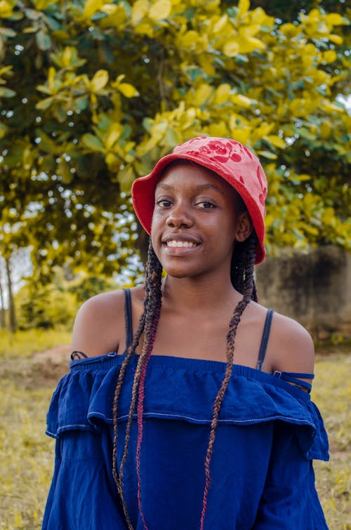 A Smiling Woman in a Red Hat