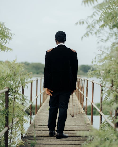 Elegant Man on Footbridge