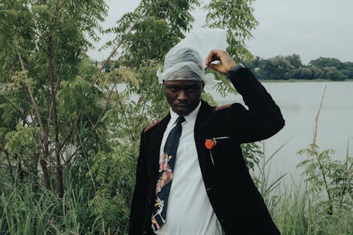 African Man Wearing Suit by the Lake