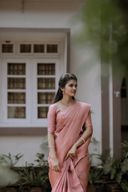 Model in Traditional Indian Clothing in Front of a Building