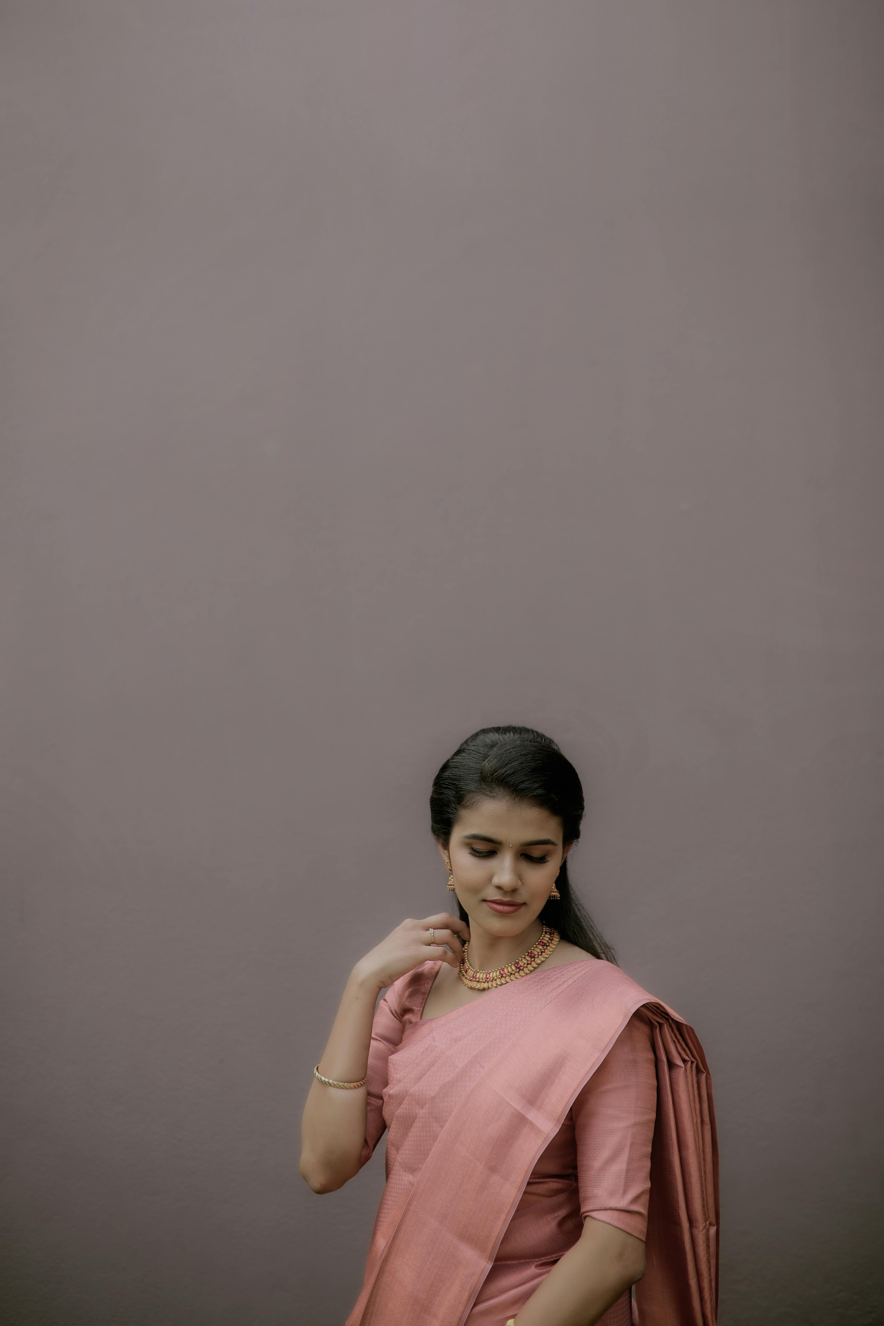 Indian woman in studio, fashion portrait of pose style with arms