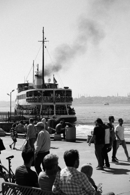 Free Monochrome view of a busy ferry and people along Istanbul's Bosporus. Stock Photo