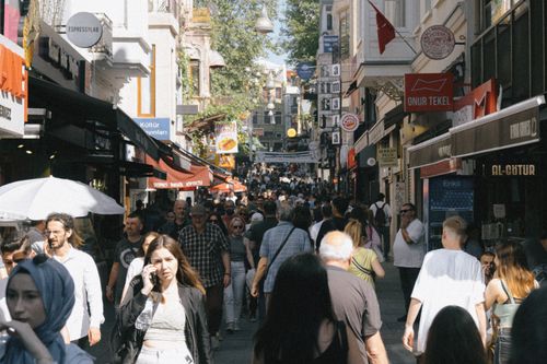 Free A busy street filled with pedestrians and storefronts in Istanbul, capturing urban life and travel vibes. Stock Photo
