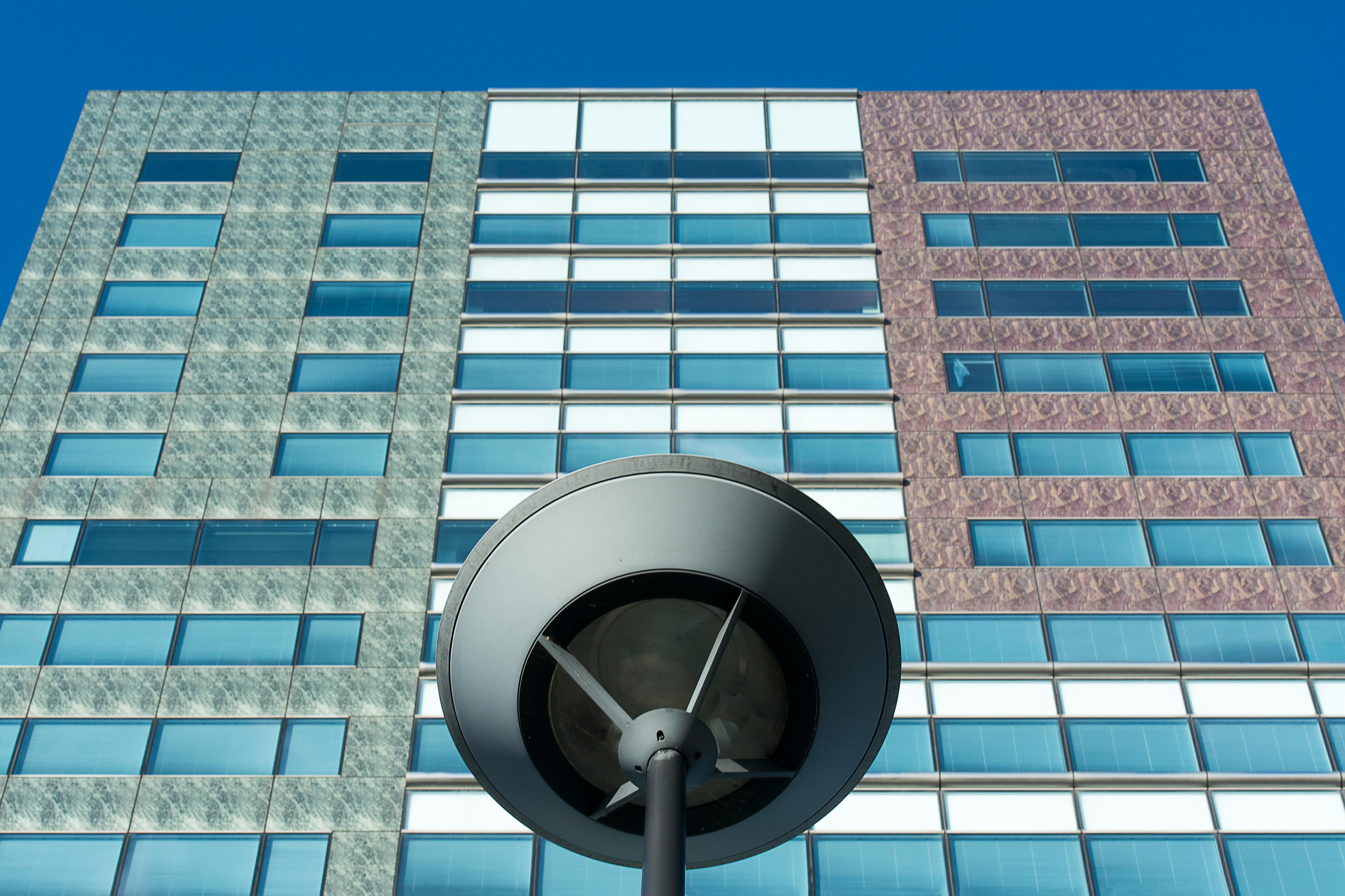 building wall behind street lamp