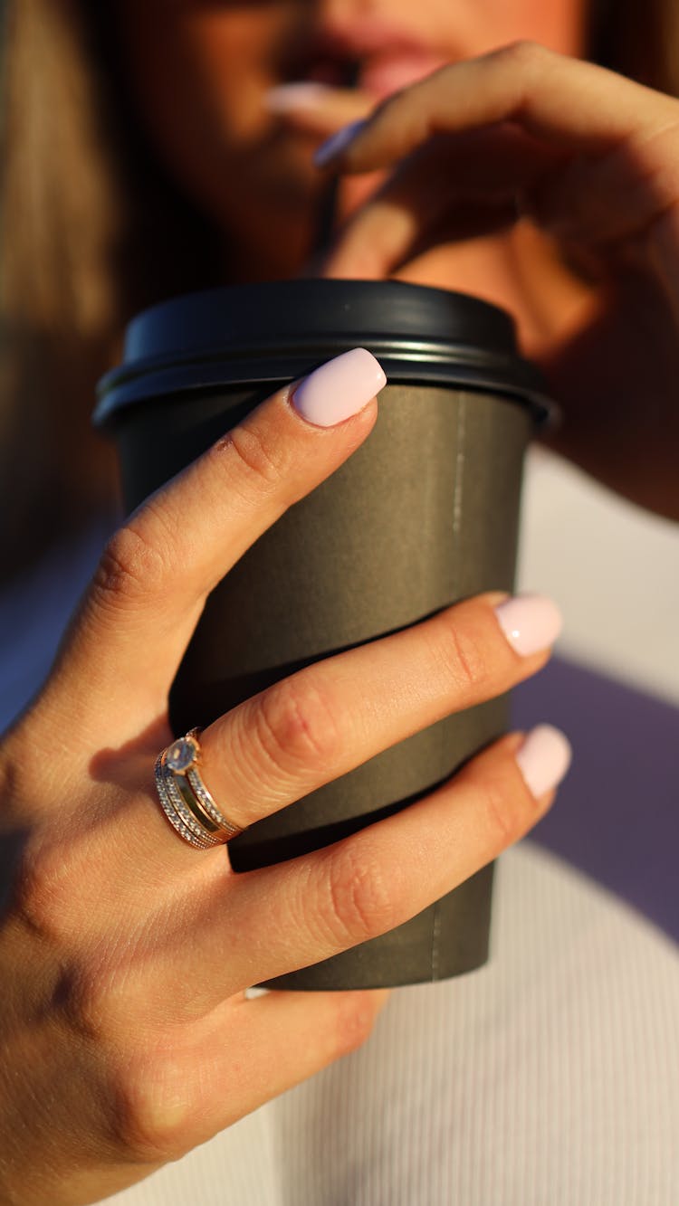 Woman Hand Holding Cup