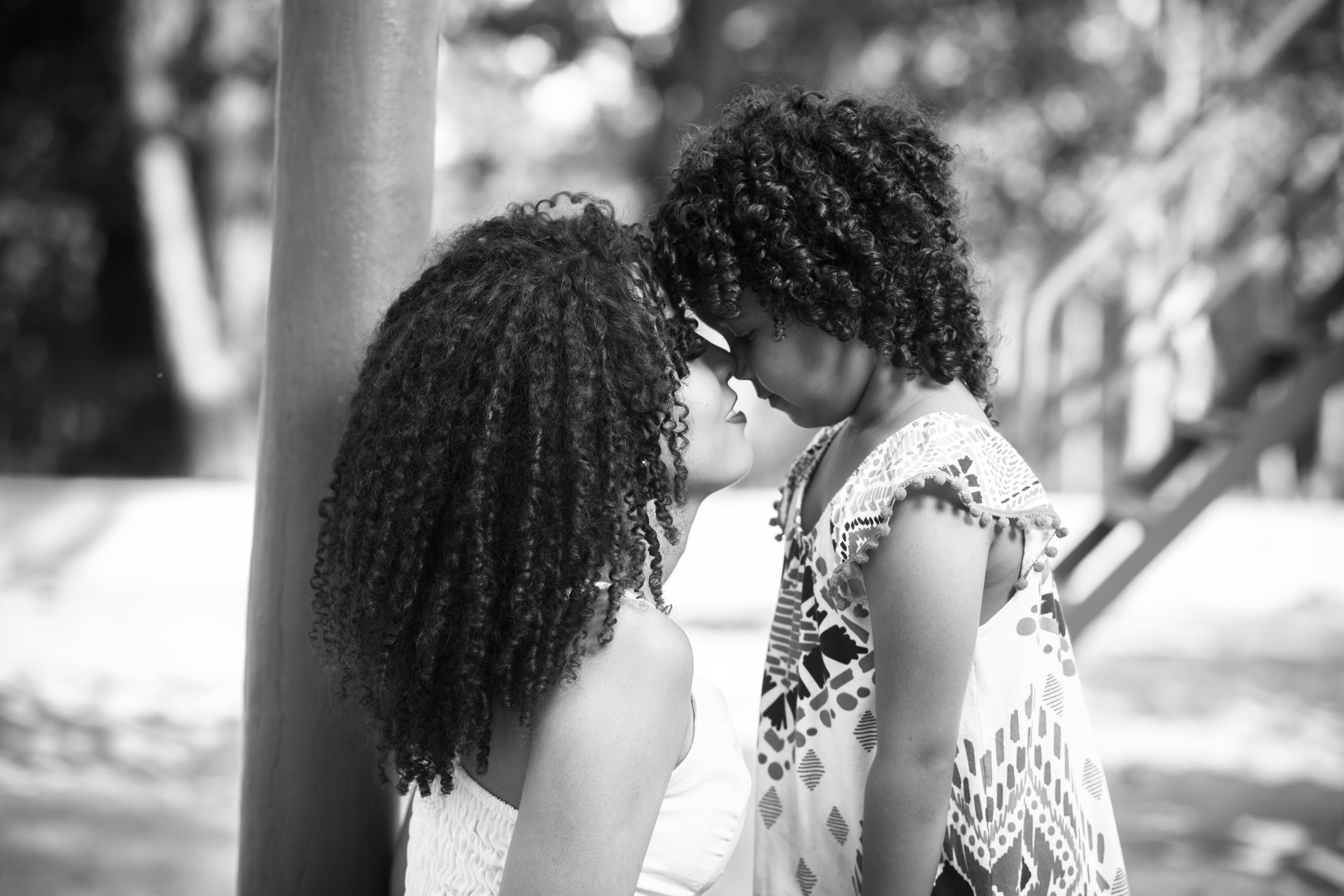 mother and daughter together in black and white