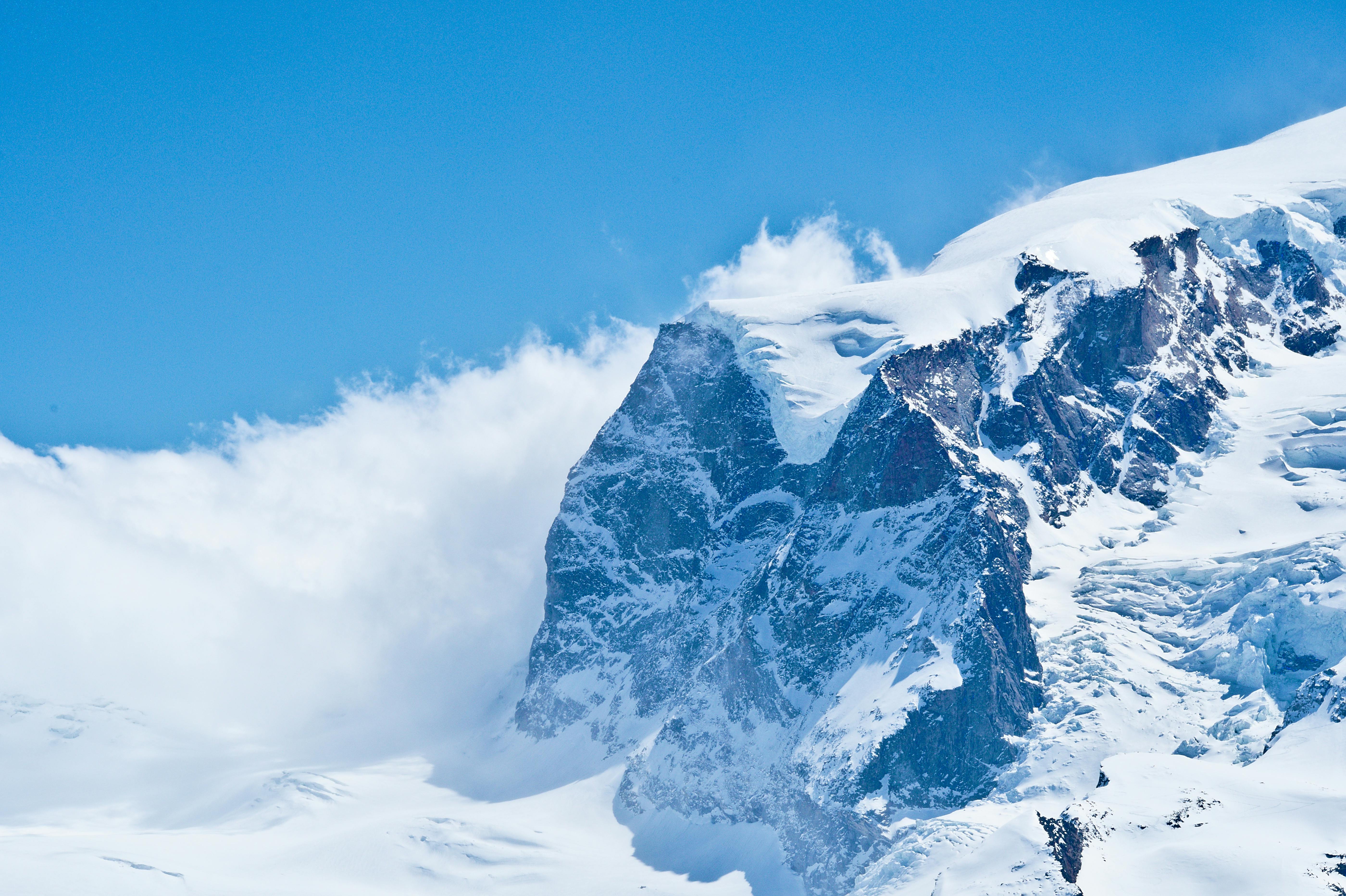 Prescription Goggle Inserts - Breathtaking view of snow-capped mountains under a clear blue sky in Zermatt, Switzerland.