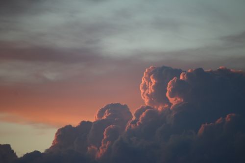 Free Captivating view of sunset clouds in the sky with rich hues, creating a dramatic scene. Stock Photo
