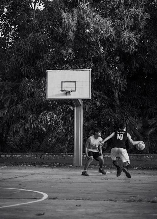 Two Men Playing Basketball 