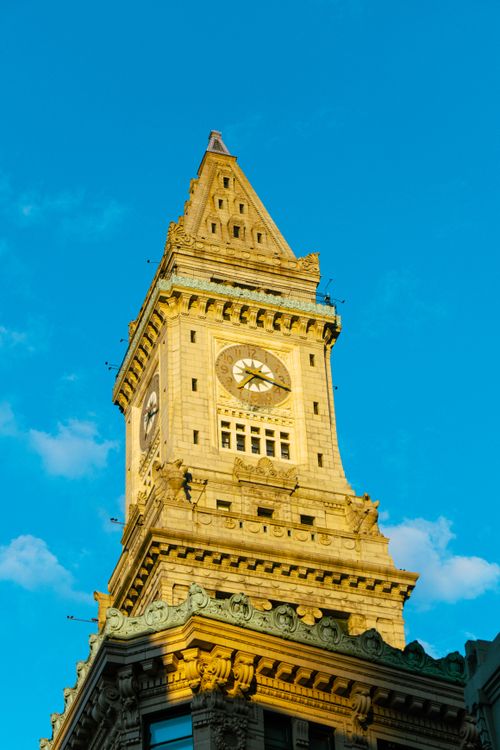Free Low angle view of the iconic Custom House Tower in Boston against a clear blue sky. Stock Photo