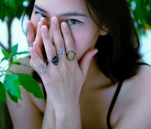 Woman Covering Face with Hands 