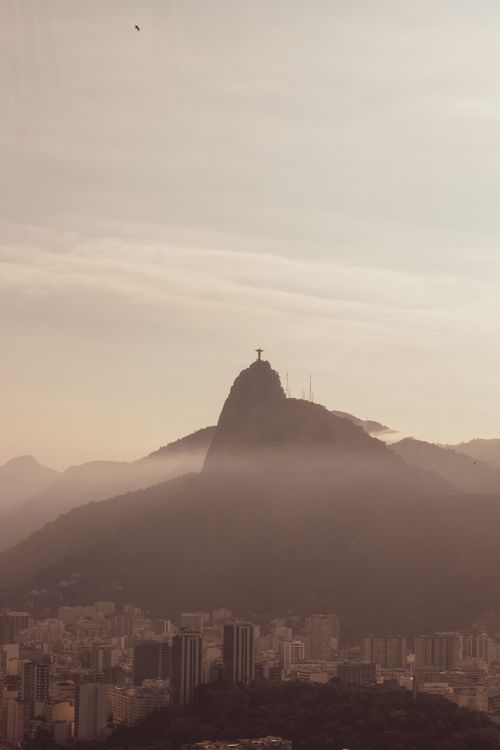 Free Scenic view of Christ the Redeemer atop Corcovado Mountain in Rio de Janeiro at dawn. Stock Photo