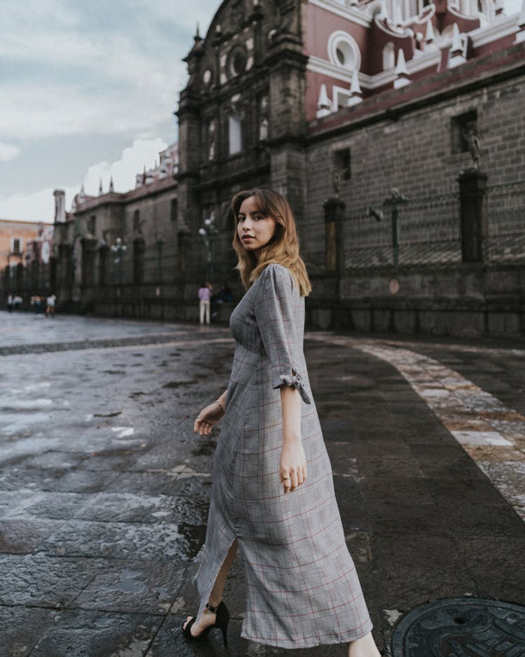 Young Woman Walking In Front Of The Cathedral In Puebla, Mexico 