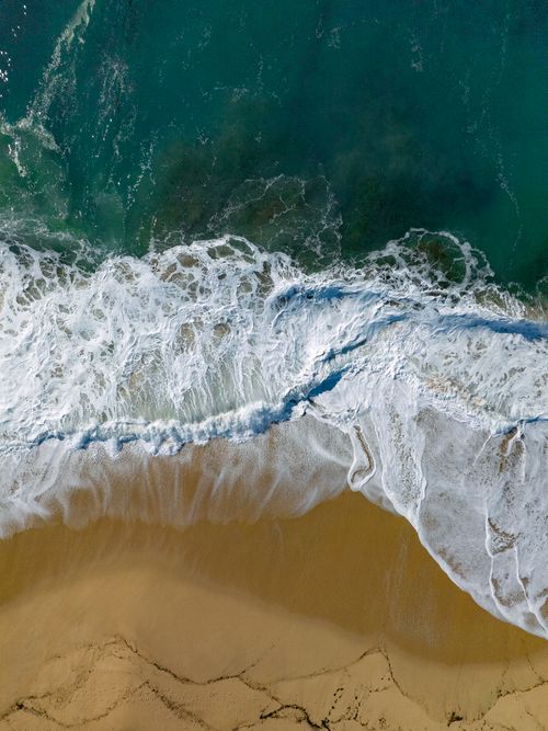 Free Aerial view of waves crashing on the Algarrobo coastline, Valparaíso, Chile Stock Photo