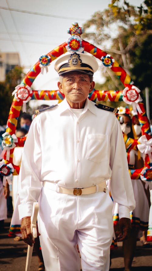Man in White Uniform on Parade