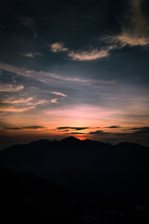 Foto profissional grátis de céu, iluminado por trás, montanha