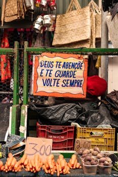 Vibrant market stall showcasing fresh vegetables and a welcoming sign.