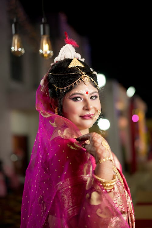 Woman in Traditional Wedding Clothes and Jewelry 