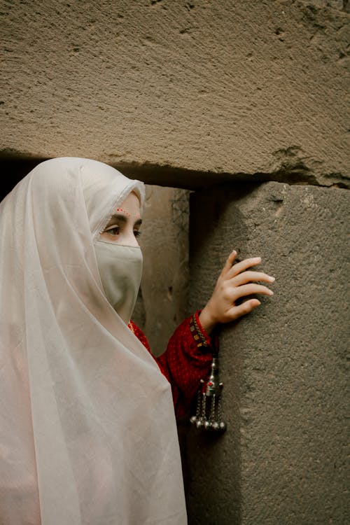 Free Woman in White Veil Standing in Doorway Stock Photo