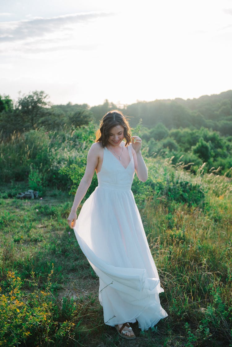 Woman In White Dress Posing In Nature