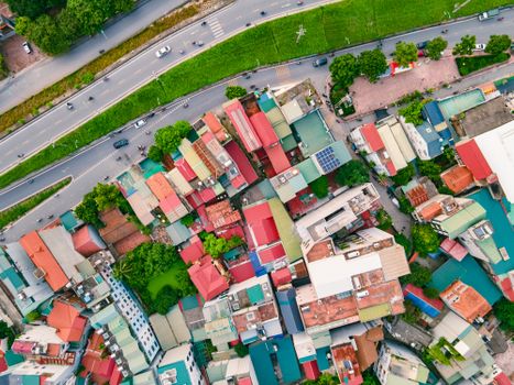Colorful rooftops in a dynamic city neighborhood from above.