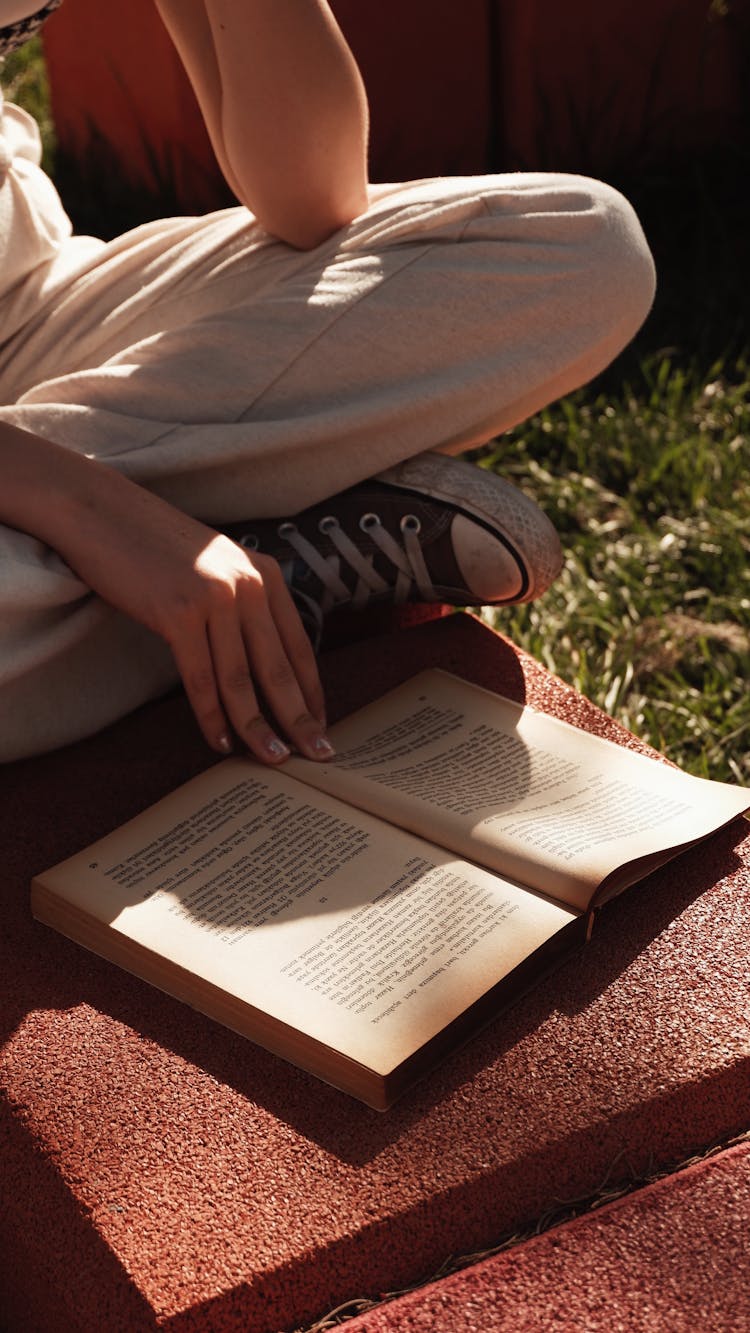 Woman Hand On Book