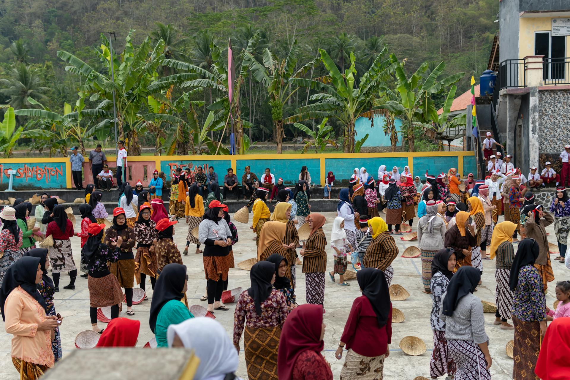 A vibrant cultural festival in Pacitan, Indonesia with locals in traditional attire.