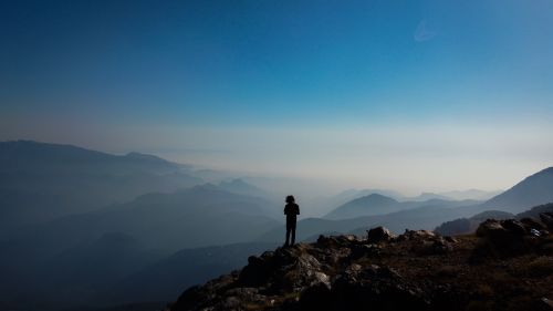 Free A lone hiker stands on a mountain peak in Osmaniye, Türkiye, with layers of mountains stretching into the horizon. Stock Photo