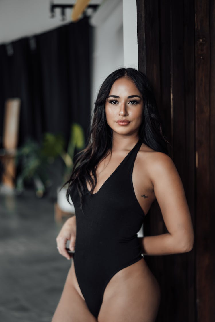 Standing Woman Posing In Black Swimsuit