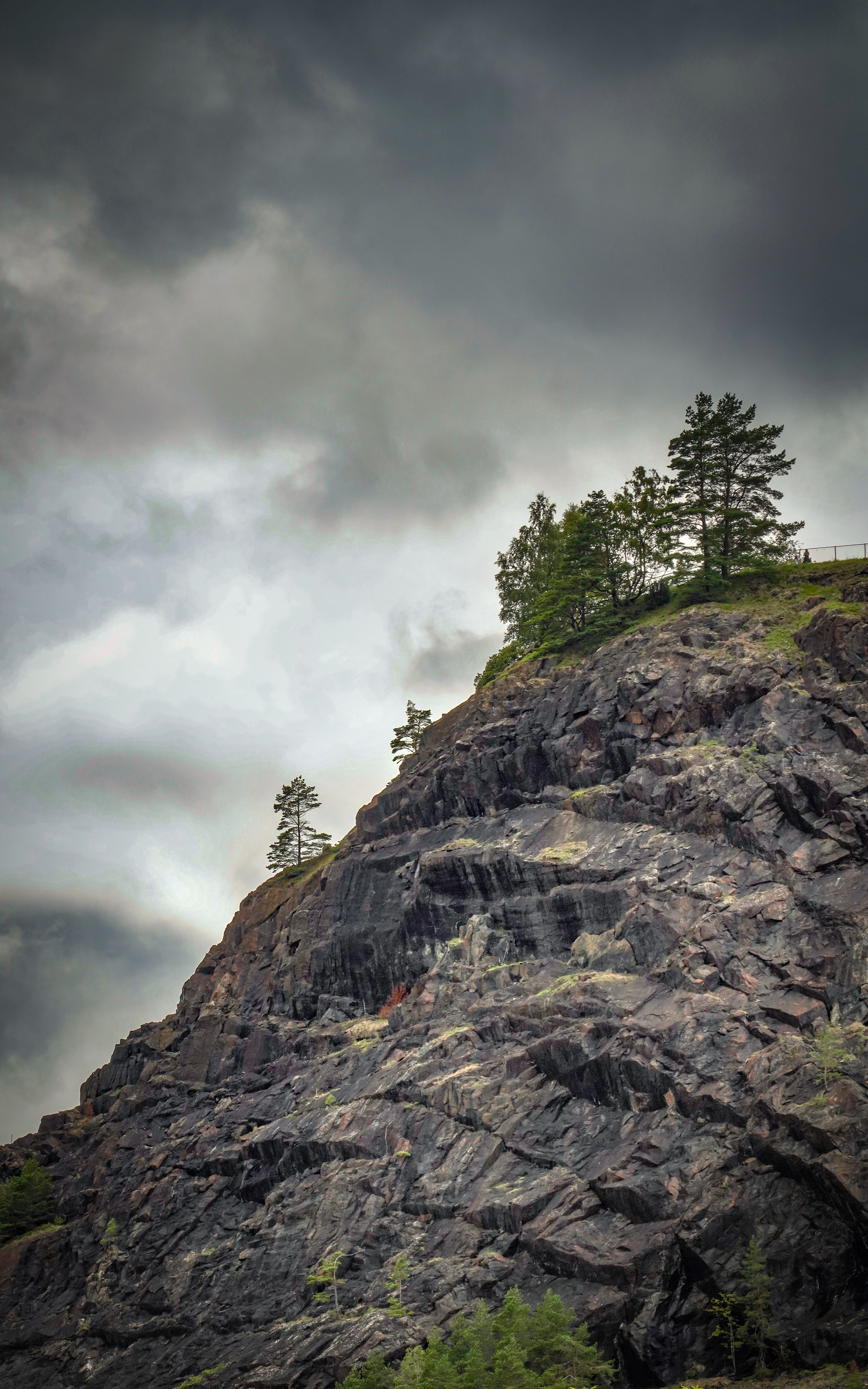 Rain Clouds over Hill on Rocks · Free Stock Photo