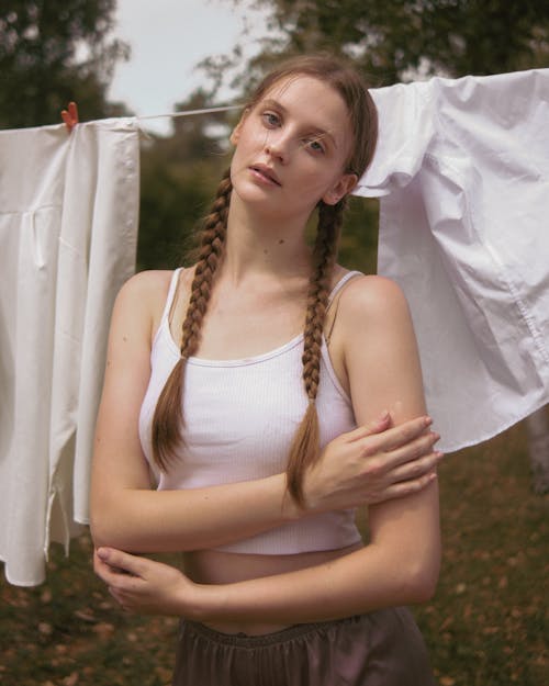 Woman in White Crop Standing by Hanging on Rope Laundry