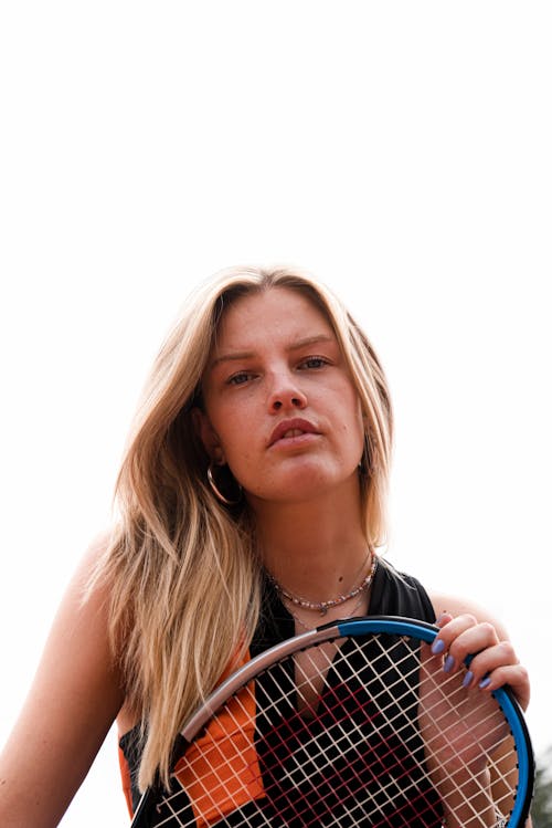 Blonde Woman with Tennis Racket