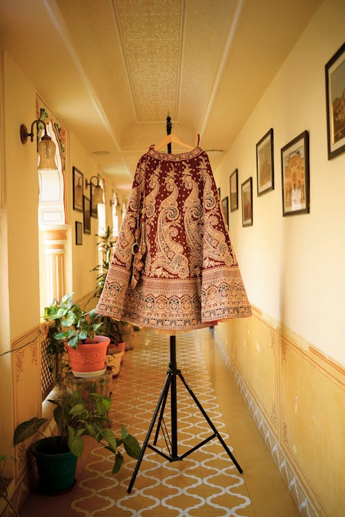 Traditional Clothing on Hanger in Corridor
