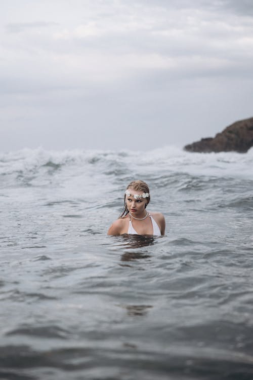 A woman in a swimsuit in the ocean