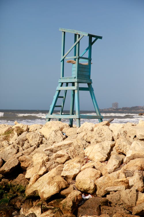 Blue Lifeguard Tower on Rocky Sea Shore