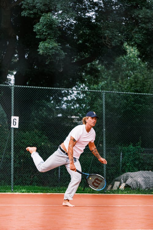 Tennis player barefoot on the court