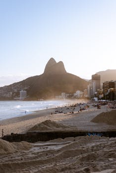 Captivating shot of Ipanema Beach with mountains in the background. Enjoy the summer vibes of Rio de Janeiro.