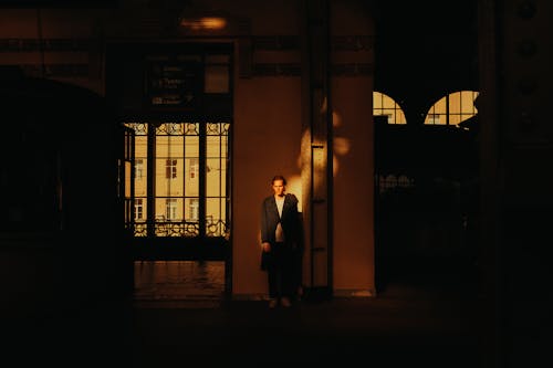 Man Standing in Railway Waiting Hall 