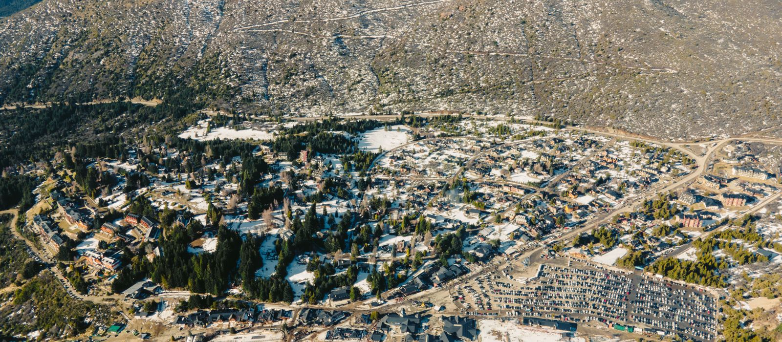 Snow-covered San Carlos de Bariloche from above, showcasing winter scenery. — flights from Buenos Aires to San Carlos de Bariloche