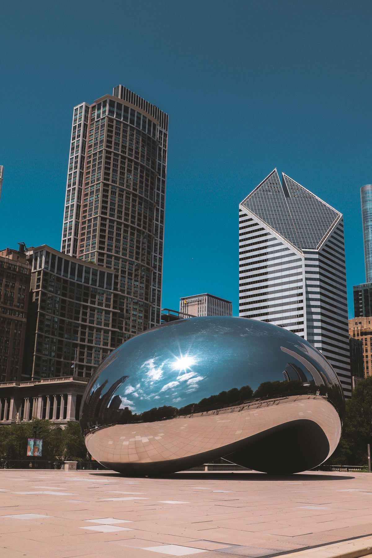 Cloud Gate reflecting the Chicago skyline and spring light in Millennium Park.