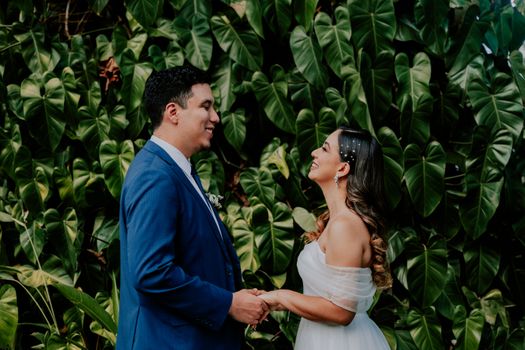 Smiling and Happy Newlyweds Standing Face to Face