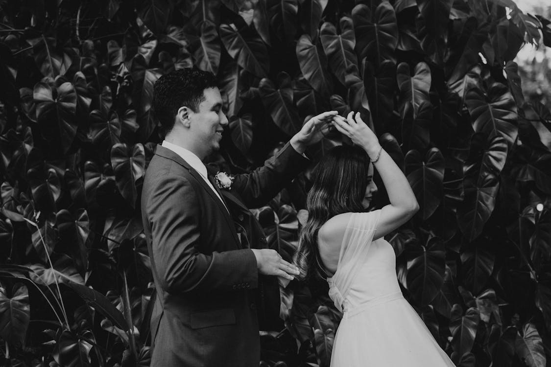 Smiling Newlyweds Holding Hands