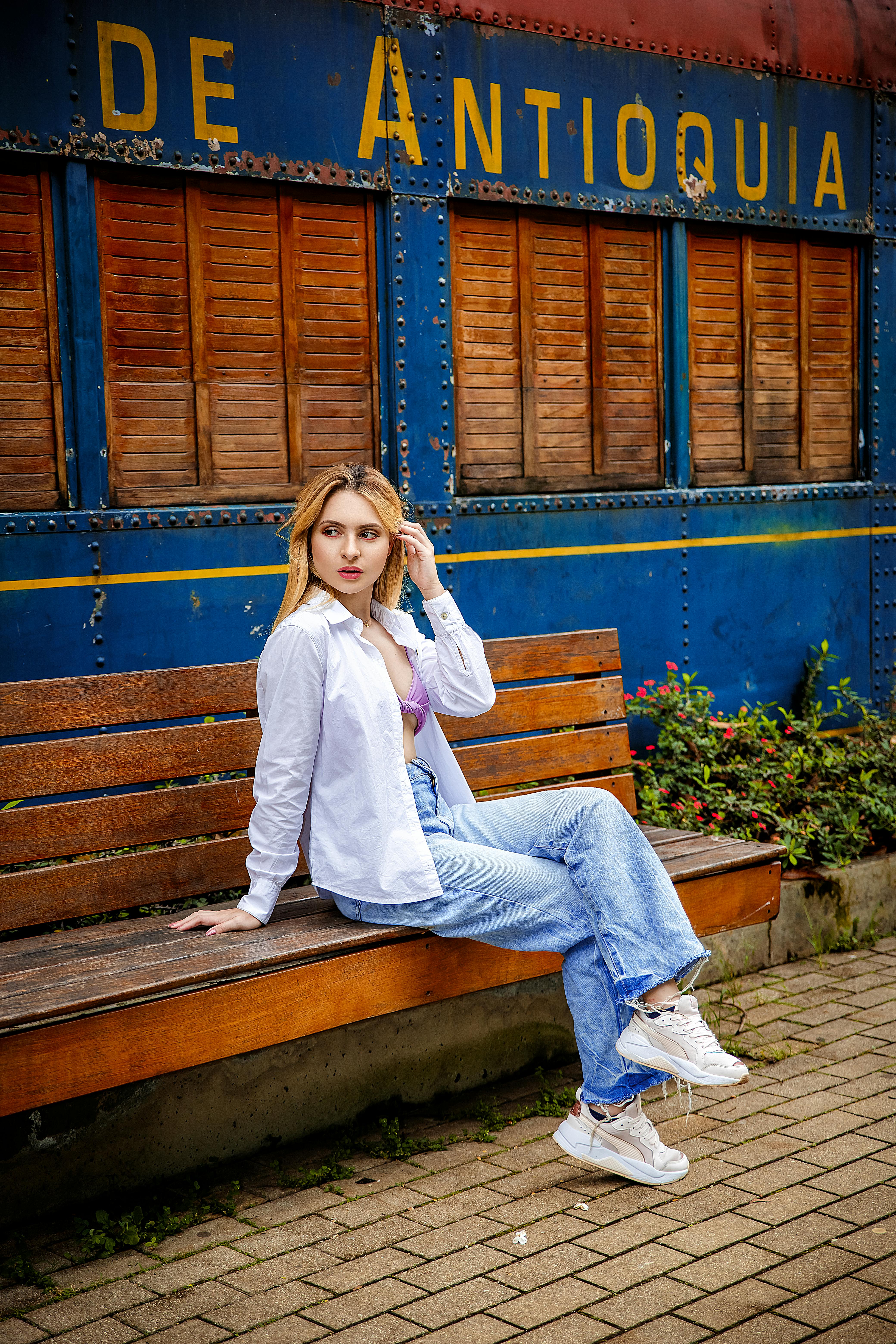 Girl poses and relaxed on bench Stock Photo | Adobe Stock